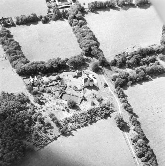 Oblique aerial view centred on the country house, taken from the ENE.