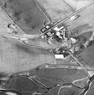 Oblique aerial view centred on tower house from SE.
