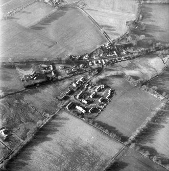 Oblique aerial view centred on village from E.