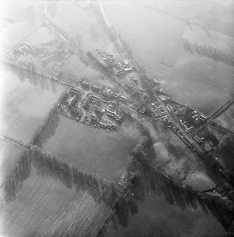 Oblique aerial view centred on village from N.