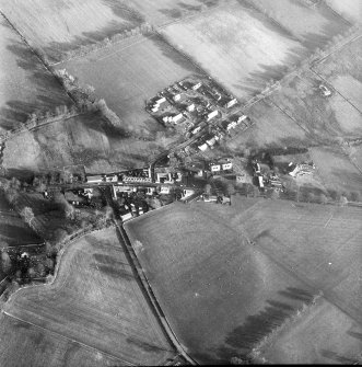 Oblique aerial view centred on village from W.