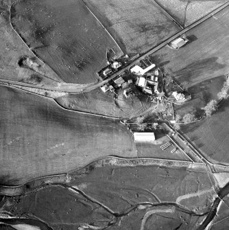 Oblique aerial view centred on tower house from SE.