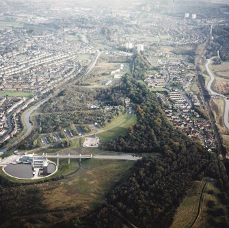 General oblique aerial view looking across the Falkirk Wheel and canals towards Falkirk and Grangemouth, taken from the W.