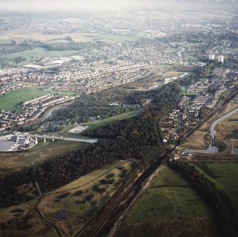 General oblique aerial view looking across the Falkirk Wheel and canals towards Falkirk and Grangemouth, taken from the W.