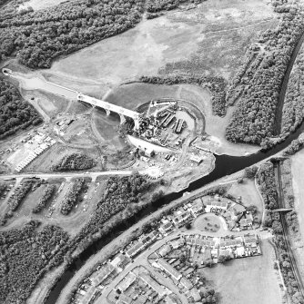 Oblique aerial view centred on the construction of the canal lift, canal basin, slipway, lock and aqueduct with the canal tunnel adjacent, taken from the ENE.