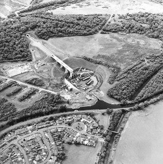 Oblique aerial view centred on the construction of the canal lift, canal basin, slipway, lock and aqueduct with the canal tunnel adjacent, taken from the NNE.