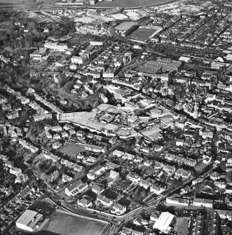 General oblique aerial view of the shopping centre and church, taken from the SE.