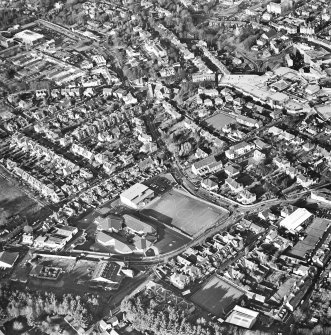 General oblique aerial view of the shopping centre and church, taken from the SE.