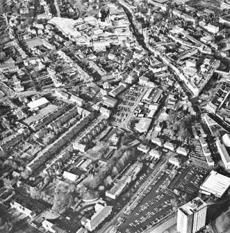 General oblique aerial view of the shopping centre and church, taken from the SE.