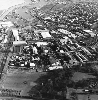 Oblique aerial view of the chemical works and docks taken from the SW.