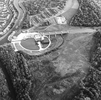 Oblique aerial view centred on the Falkirk Wheel with the remains of the works adjacent, taken from the W.