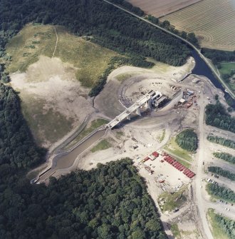 Oblique aerial view centred on the construction of the Falkirk Wheel, taken from the SE.