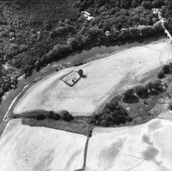 Oblique aerial view centred on burial ground from NE.