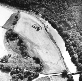 Oblique aerial view centred on burial ground from NW.