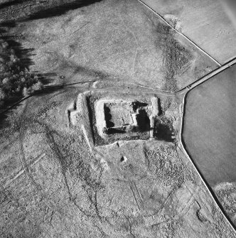 Oblique aerial view centred on castle from E.