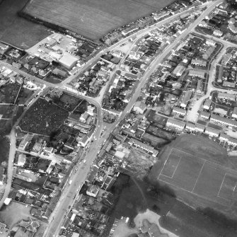 Oblique aerial view centred on town house from SE.