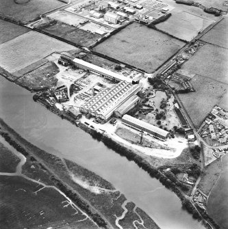 Oblique aerial view centred on boiler works from N.