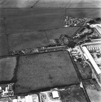 Oblique aerial view from SE.