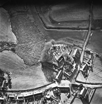 Dalton, oblique aerial view, taken from the NE, centred on the old parish church and the parish church.  A road bridge is visible in the top right hand corner of the photograph.