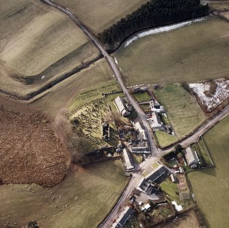 Dalton, oblique aerial view, taken from the ENE, centred on the old parish church and the parish church.  A road bridge is visible in the centre top half of the photograph.
