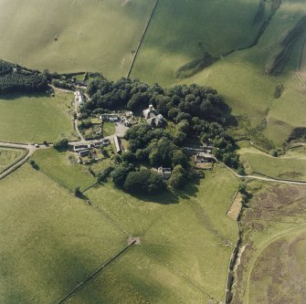 Oblique aerial view from SE of village with the parish church in the centre.