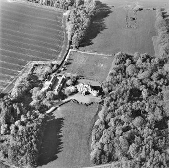 Oblique aerial view centred on the country house and stables, taken from the SSW.