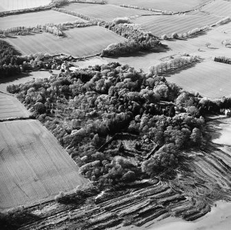 Oblique aerial view centred on the country house, stables, gardens and walled garden, taken from the SSE.