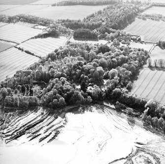 Oblique aerial view centred on the gardens and walled garden with country house, stables and house adjacent, taken from the E.