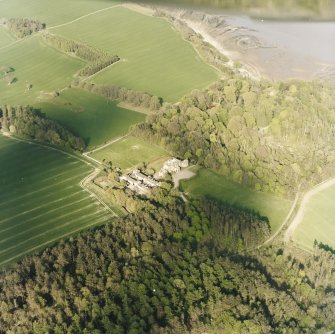 Oblique aerial view centred on the country house and stables with gardens, adjacent, taken from the WSW.