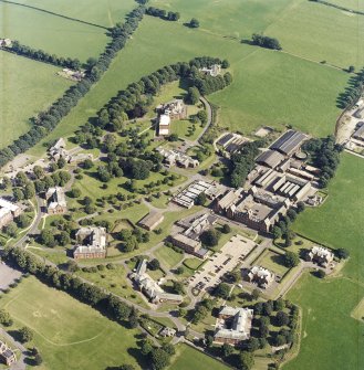 Oblique aerial view centred on the hospital, taken from the NW.