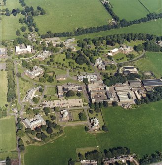 Oblique aerial view centred on the hospital, taken from the WSW.