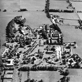Oblique aerial view centred on the hospital, taken from the NW.