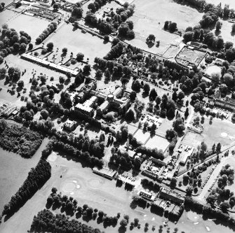 Oblique aerial view centred on the hospital, taken from the NNE.