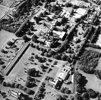 Oblique aerial view centred on the hospital, taken from the SE.