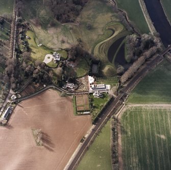 Oblique aerial view centred on the garden and country house, taken from the ESE.