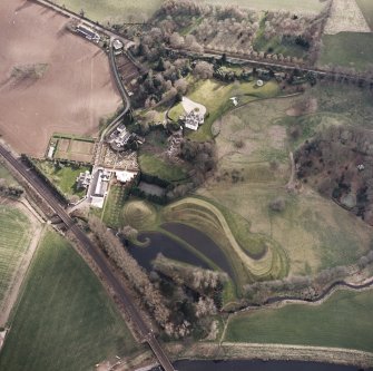 Oblique aerial view centred on the garden and country house, taken from the NNE.
