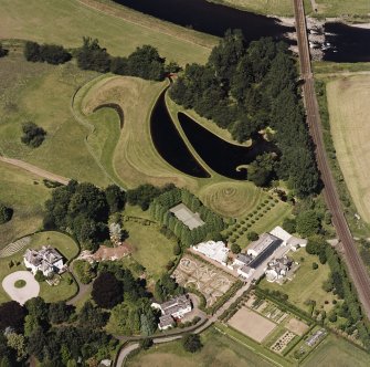 Oblique aerial view centred on the garden and country house, taken from the SSE.