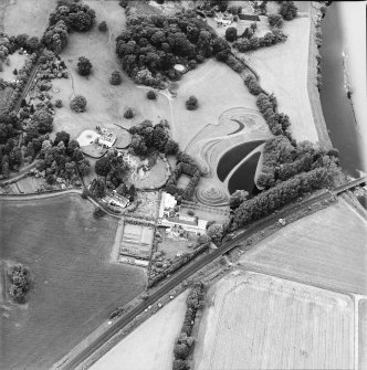 Oblique aerial view centred on the country house and garden, taken from the ESE.