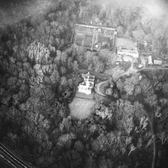 Oblique aerial view centred on country house from S.