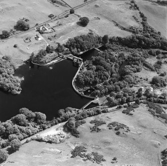 Oblique aerial view of Tongland Dam, taken from NW, centered on dam.