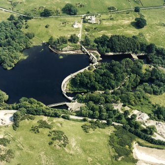 Oblique aerial view of Tongland Dam, taken from NW, centered on dam.