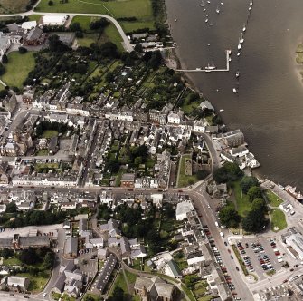 Oblique aerial view of Kirkcudbright centred on MacLellan's Tower, taken from the ESE.