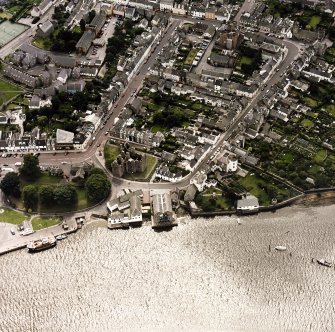 Oblique aerial view of Kirkcudbright centred on MacLellan's Tower, taken from the N.