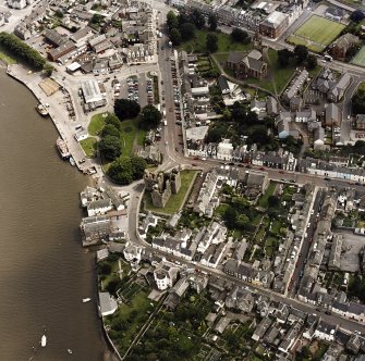 Oblique aerial view of Kirkcudbright centred on MacLellan's Tower, taken from the WNW.