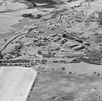 Oblique aerial view centred on Unit 1 of the explosives works and armament depot, taken from the SE.