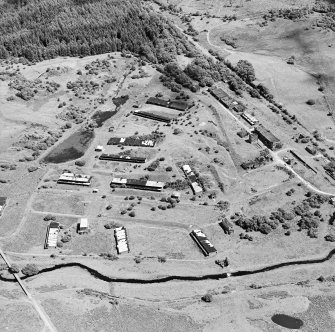 Oblique aerial view centred on Unit 1 of the explosives works and armament depot, showing the production buildings and earthworks for the internal tramway system, taken from the WNW.