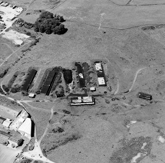 Oblique aerial view centred on Unit 2 of the explosives works and armament depot, shwoing incorporation houses and observation tower taken from the SE.