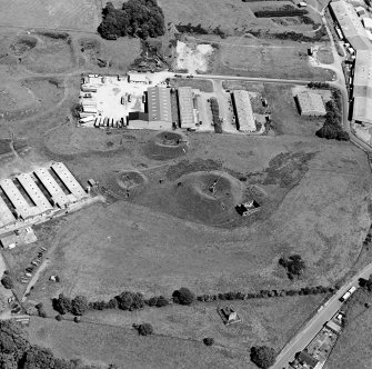Oblique aerial view centred on Unit 2 of the explosives works and armament depot, showing the earthworks for the charge houses,. taken from the SW.
Also visible is Edingham Castle, Edingham Industrial Estate with Edingham farm poultry houses.