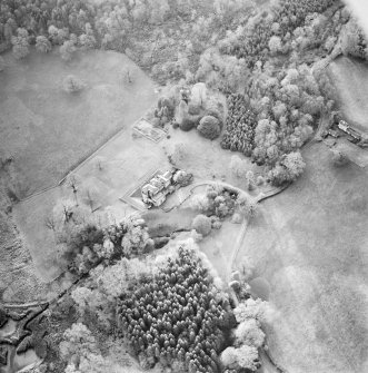 Oblique aerial view centred on the country house with tower-house and garden adjacent, taken from the NE.