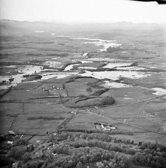 General oblique aerial view looking across Kelton Mains and Threave Castle along the River Dee during flood, taken from the ESE